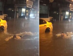 Antalya’da yollar göle döndü, bir vatandaş araçlar arasında yüzdü