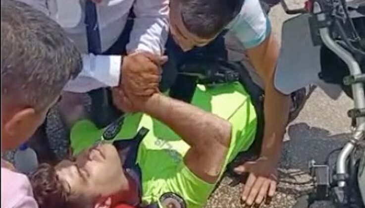 Kazada yaralanan polisin elini tutan vatandaş başından ayrılmadı